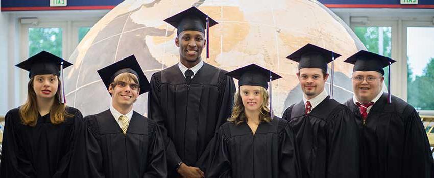 Passage USA Graduates standing in front of the Waterman Globe