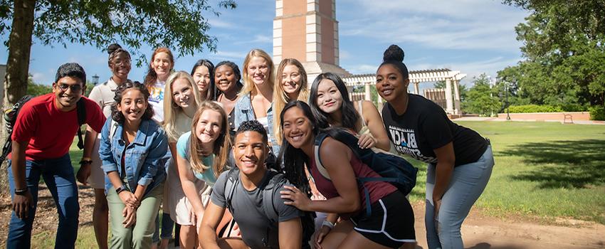 Students standing in front of Moulton Tower on campus.